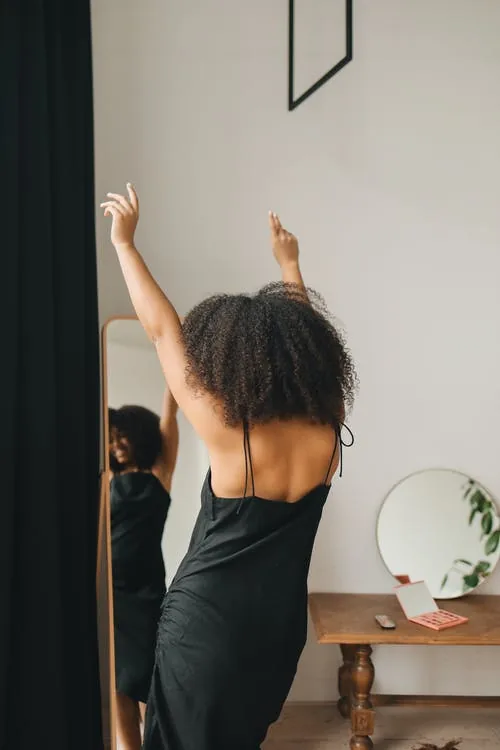 woman dancing practicing ecstatic dance movement therapy