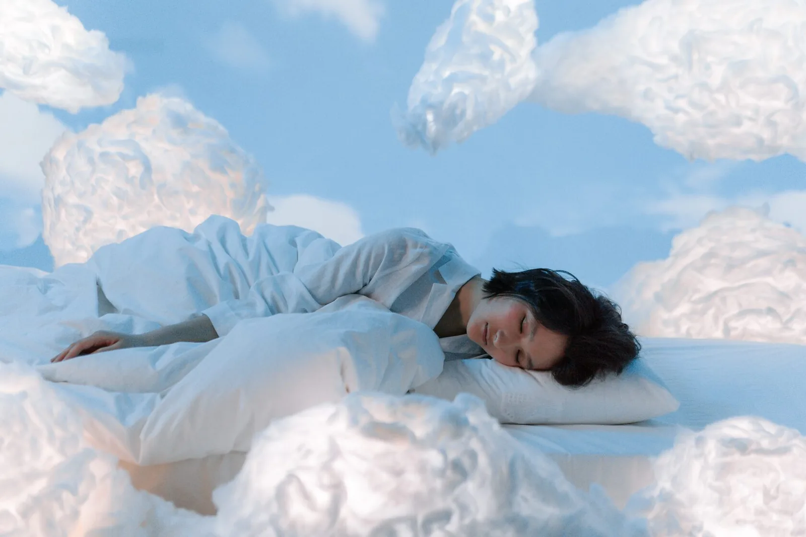 Girl sleeping on cloud 9 after bedtime meditation